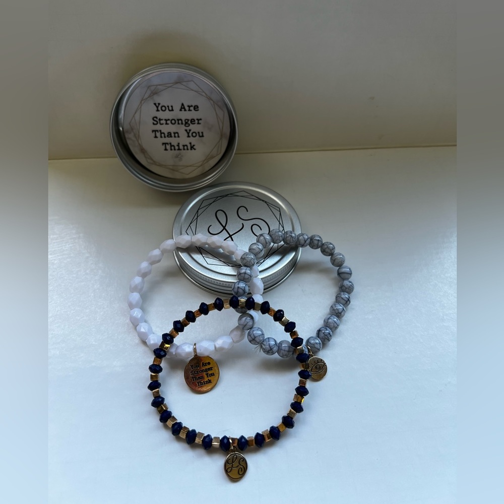 set of 3 bracelets In Tin Container.